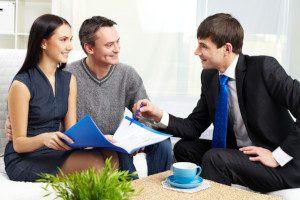 life insurance agent talking with young couple