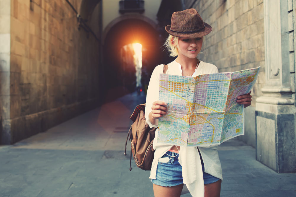 Lady traveling looking at a map