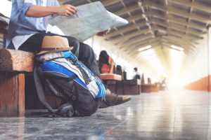 Traveler with Travelex Travel Insurance at train station