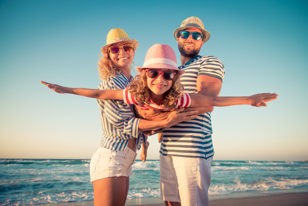 happy family traveled to the beach