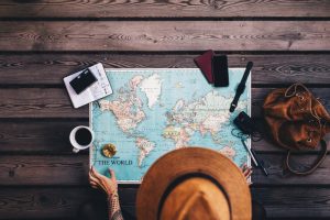 woman planning a trip with world nomad travel insurance