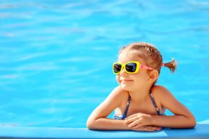 girl in swimming pool with homeowners insurance